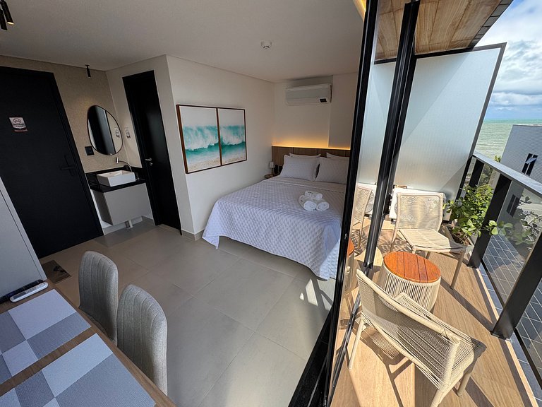 Flat beira-mar pé na areia com varanda Caribessa AH 410