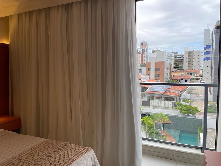 Flat com área de lazer e varanda no Caribessa