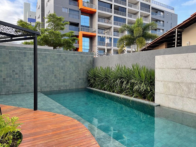 Flat com área de lazer e varanda no Caribessa