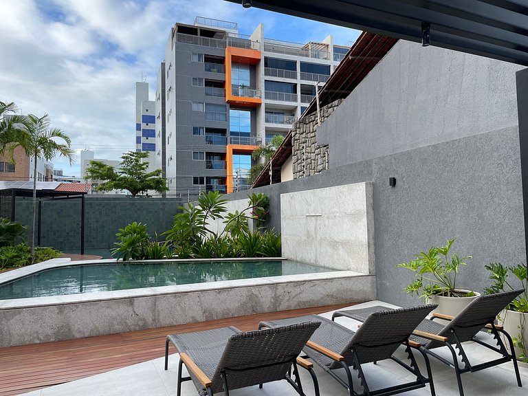 Flat com área de lazer e varanda no Caribessa